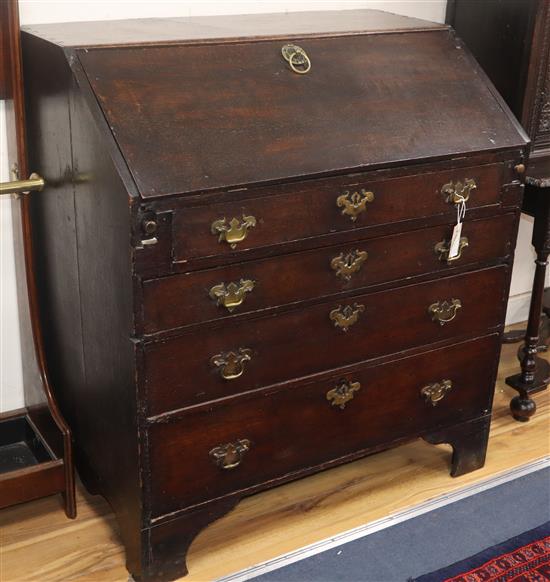 A George III oak bureau W.90cm